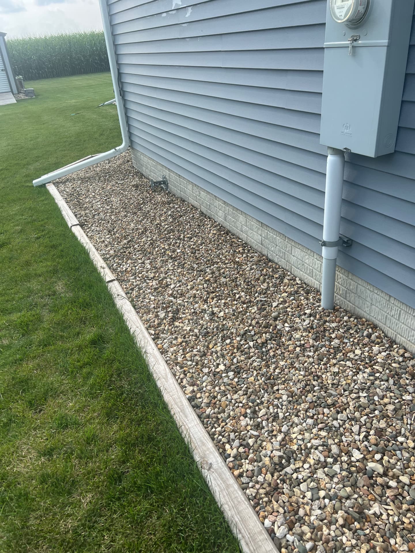 Gravel bed along a house foundation
