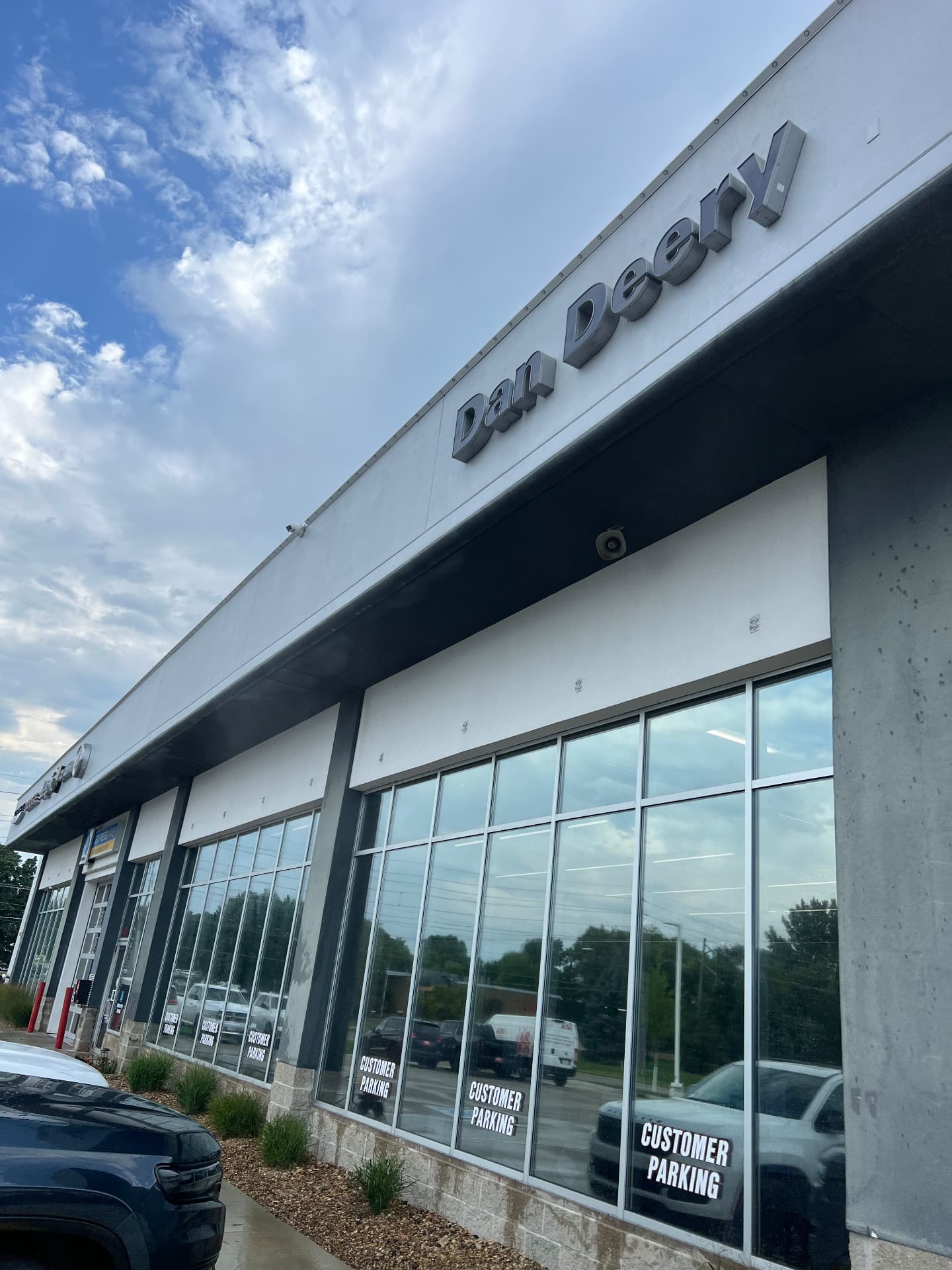 Glass and concrete frontage at the Dan Deery dealership