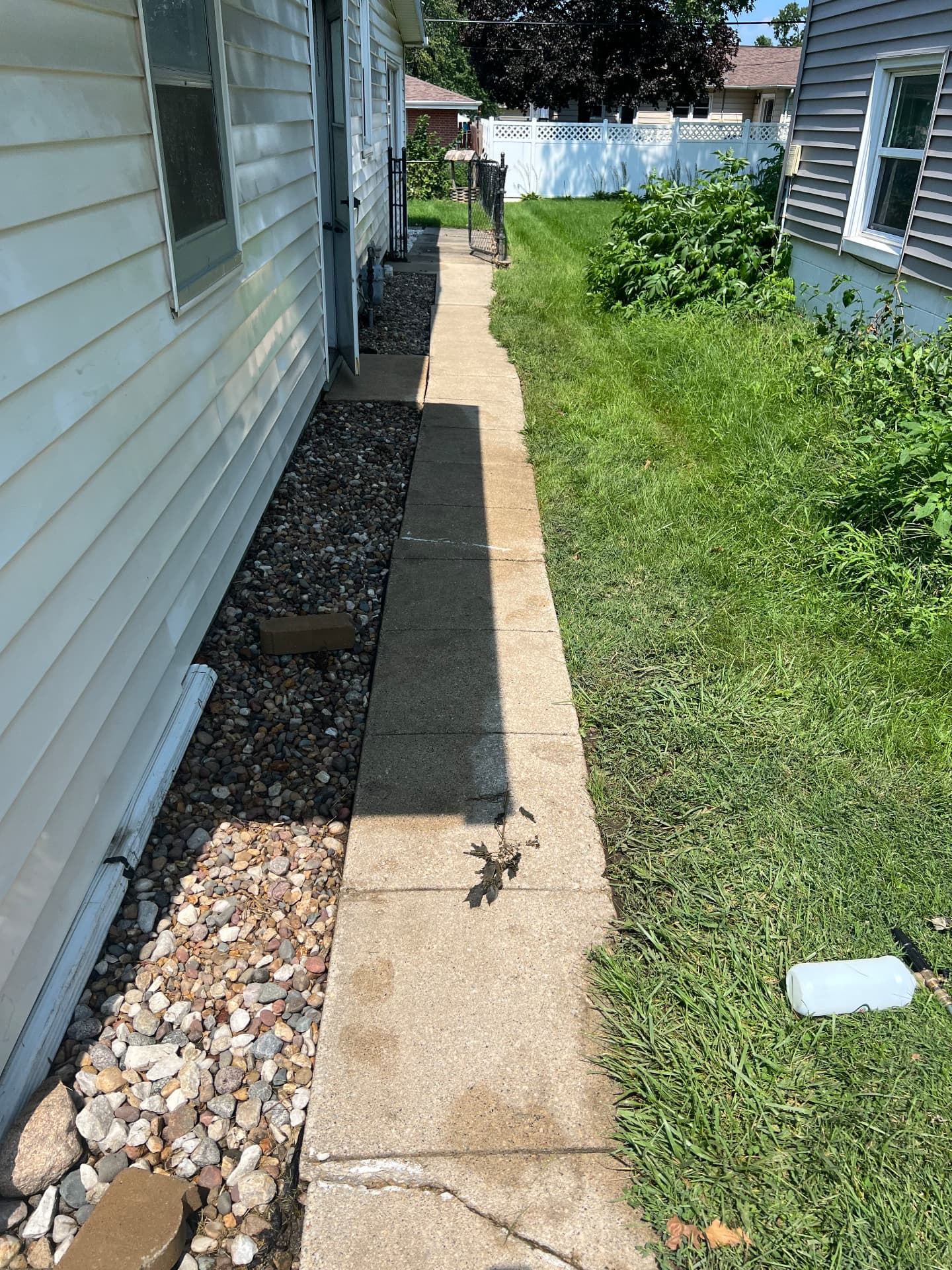 Concrete walkway between two homes